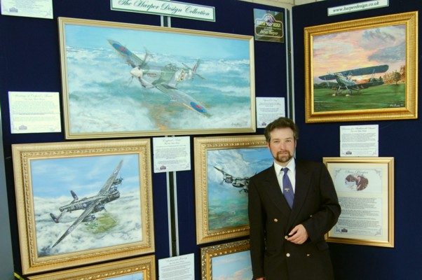 Artist Steve Harper with  exhibition of his works of  art